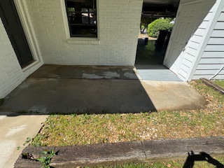 Same long side wall with bright, clean white siding after soft washing.